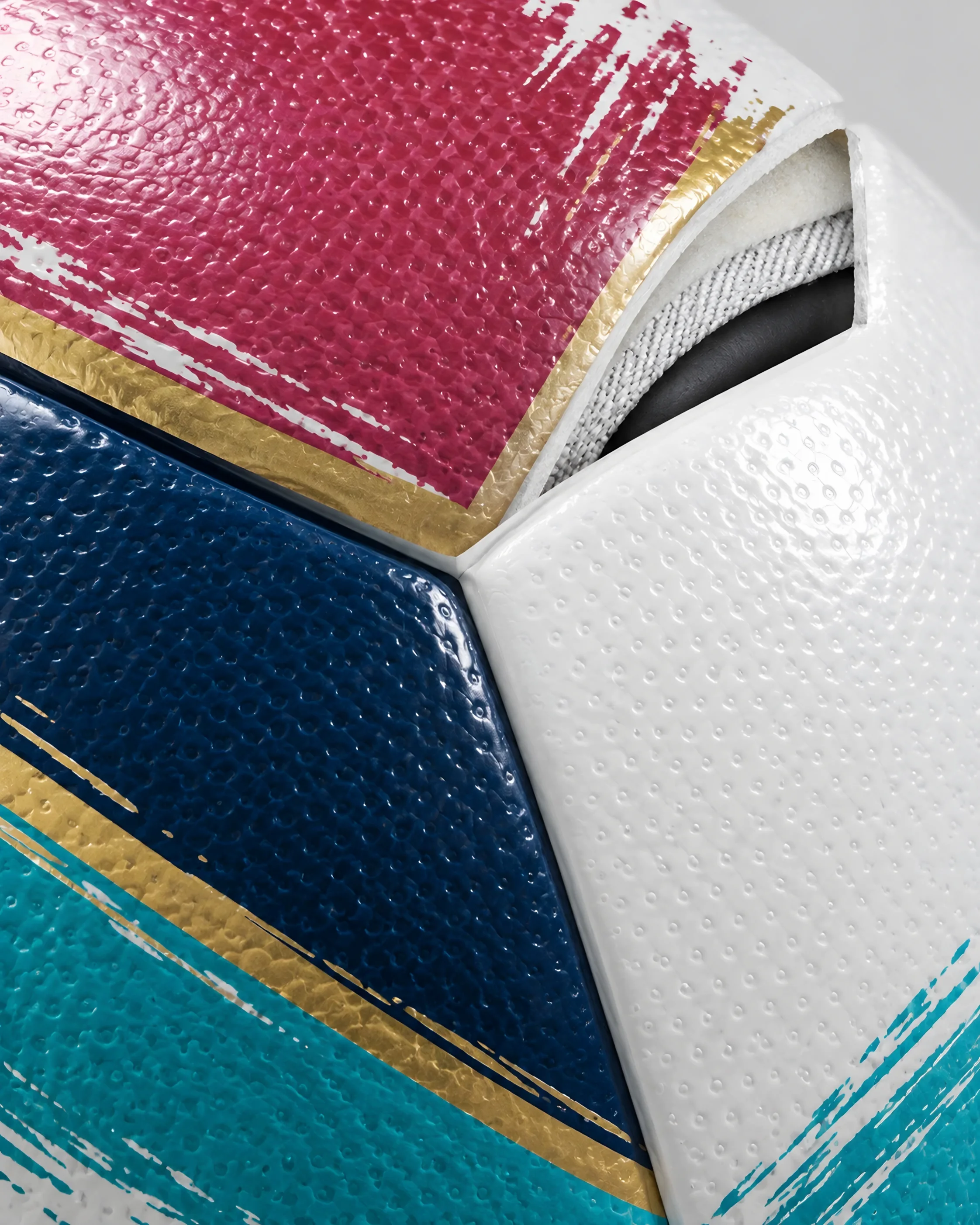 Close-up of the textured outer skin with the printed brush strokes and gold lines