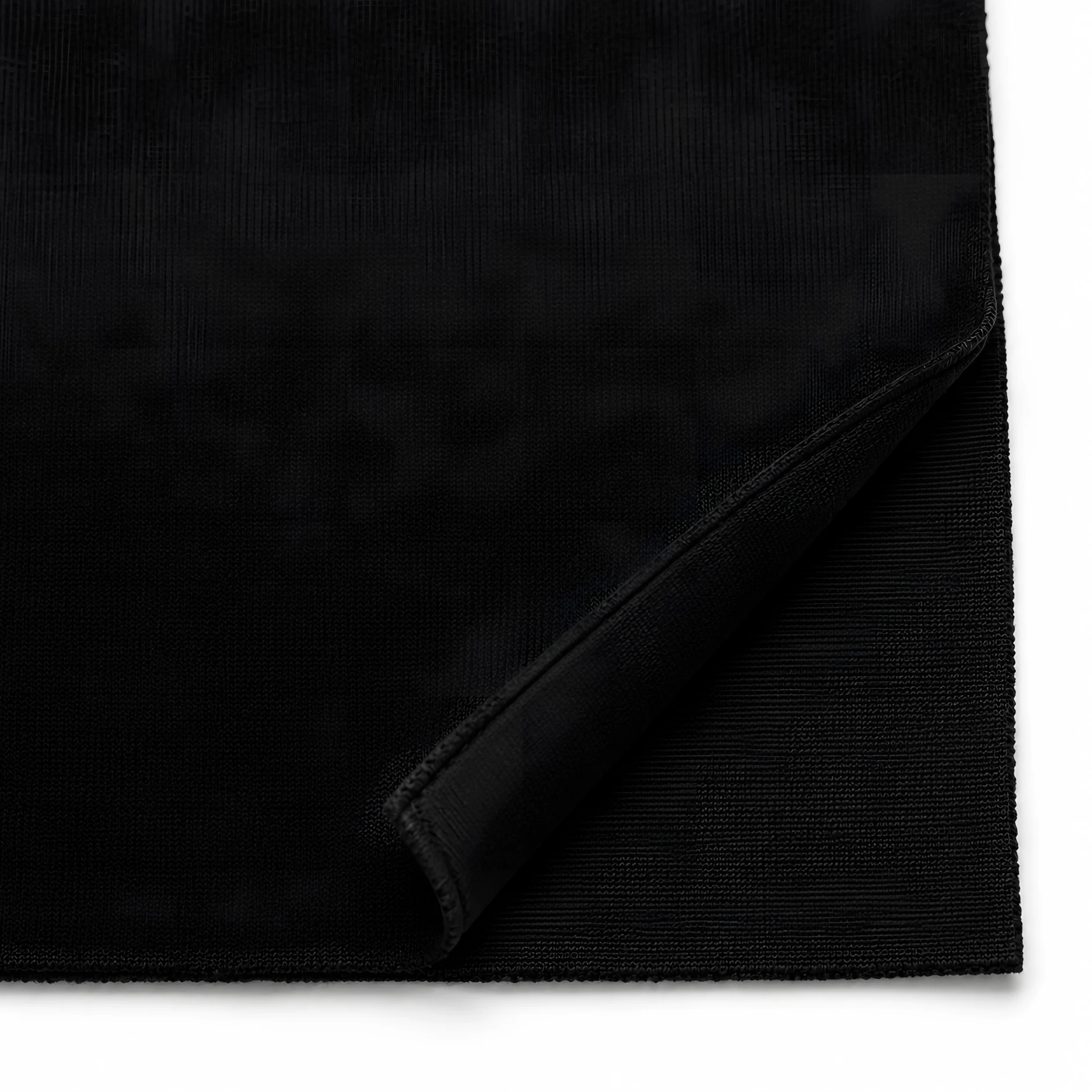 Close-up of the black hoodie fabric with a folded corner