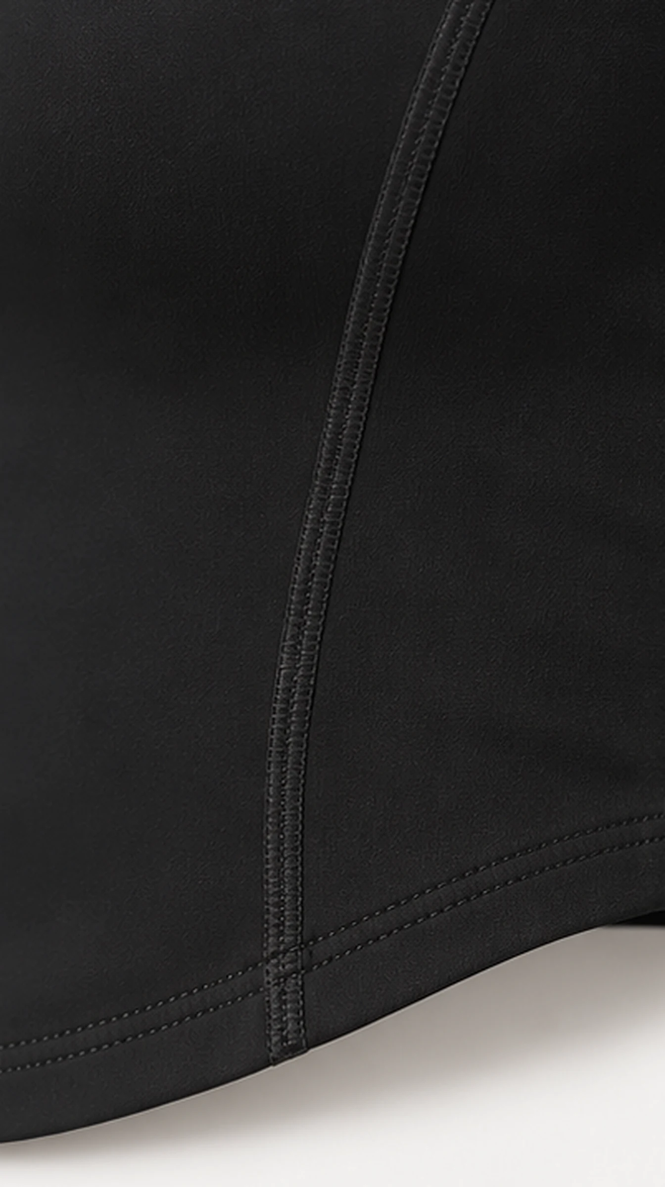 Classy Soft Mid Long Sleeve Top, close-up of the side seam and curved hem